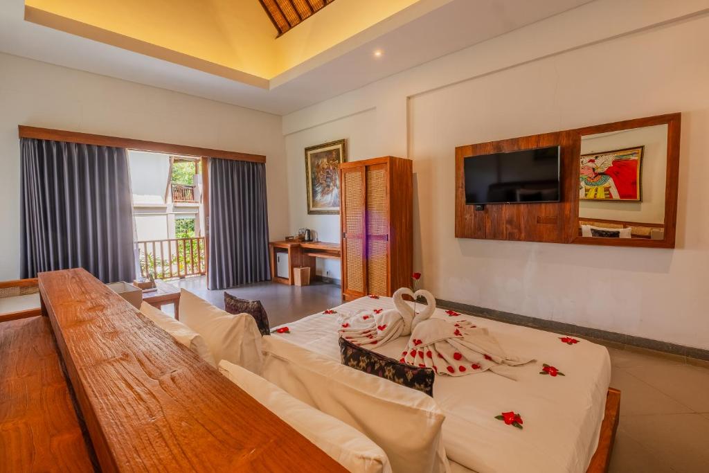 TV a/nebo společenská místnost v ubytování Alamdini Resort Ubud