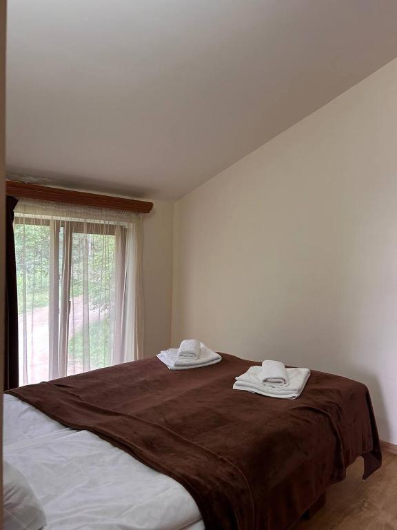Postel nebo postele na pokoji v ubytování Nectar hotel