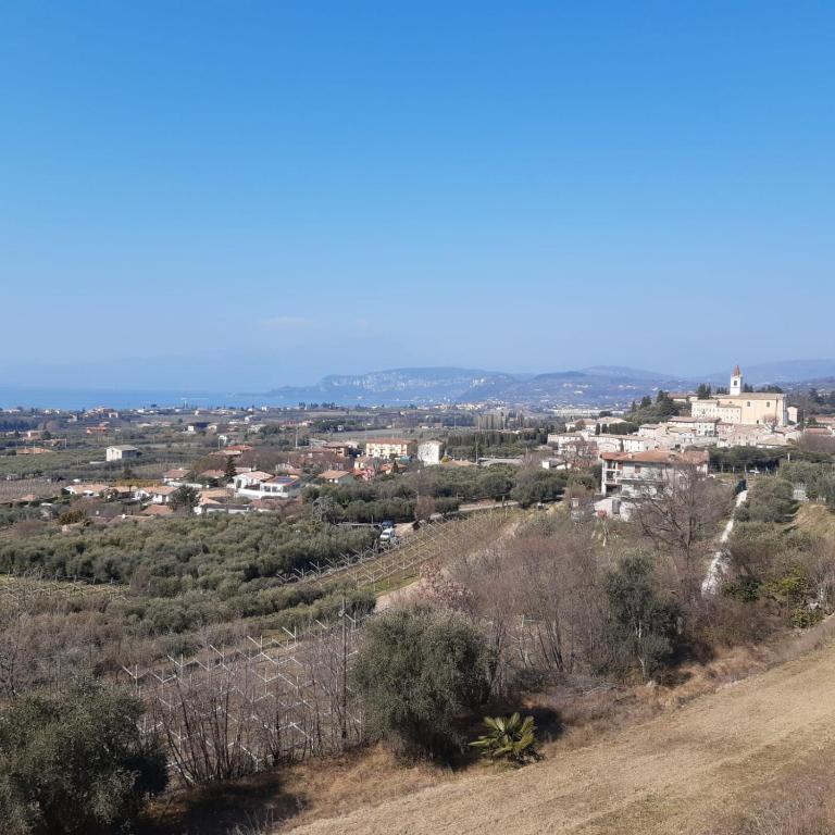 a view of a city from the top of a hill at Artisanti - DANIA HOME in Bardolino