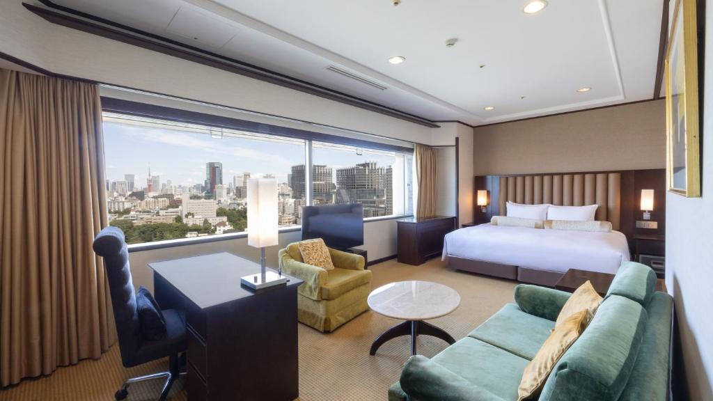 a hotel room with a bed and a large window at Grand Prince Hotel Takanawa in Tokyo