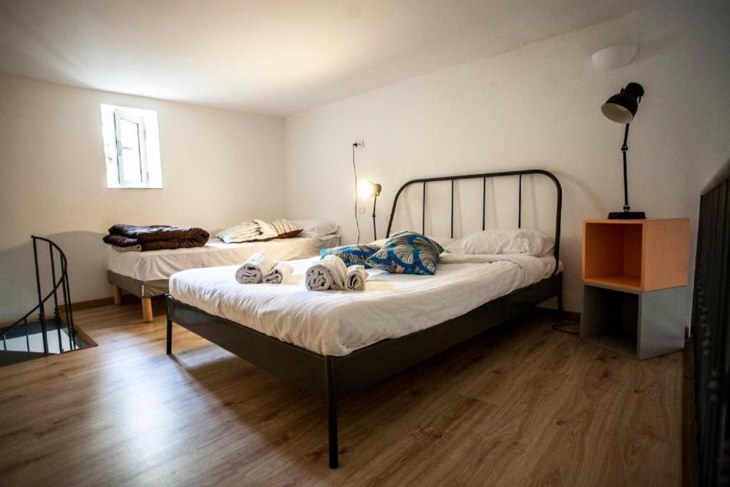 Postel nebo postele na pokoji v ubytování La Controra Hostel Naples