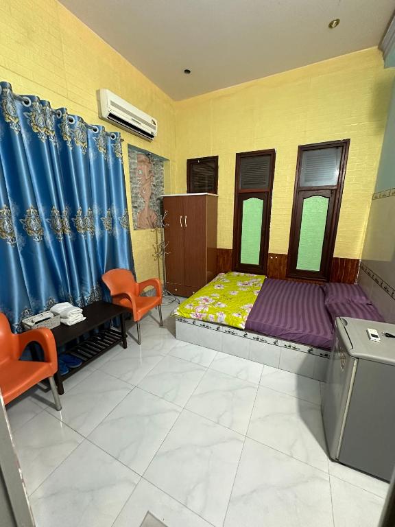 Postel nebo postele na pokoji v ubytování San Vuon Guesthouse