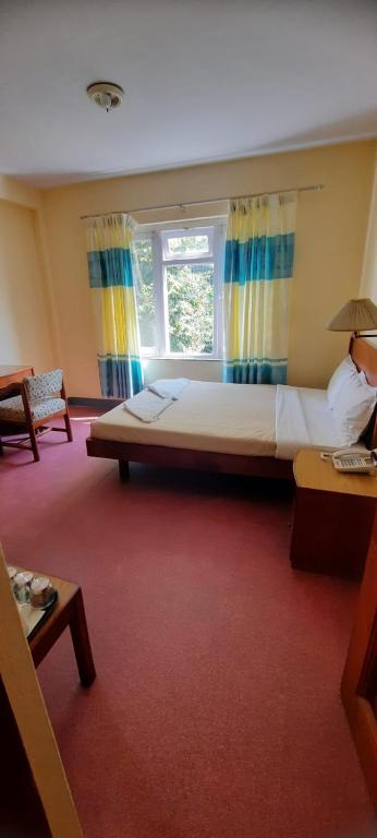 Postel nebo postele na pokoji v ubytování Hotel Sherwi Hyul