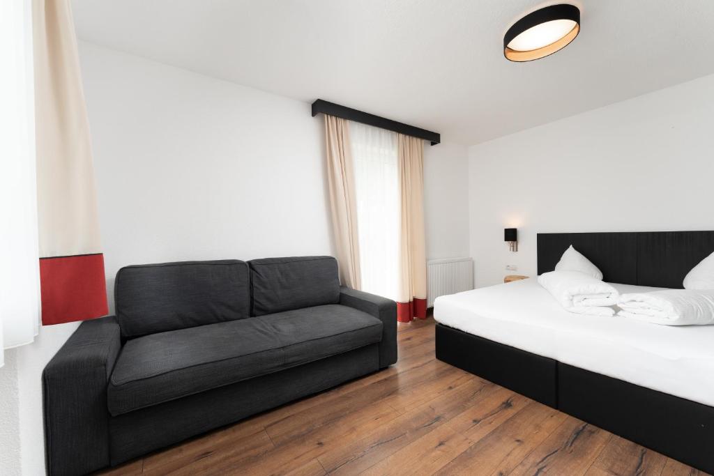A bed or beds in a room at A CASA Opal Appartements