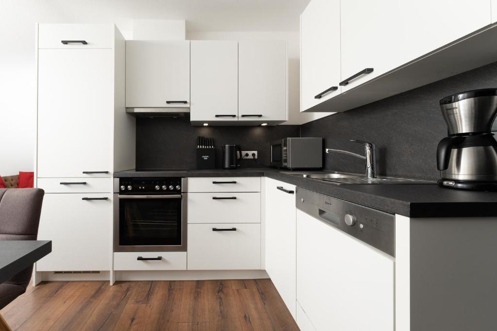 A kitchen or kitchenette at A CASA Opal Appartements
