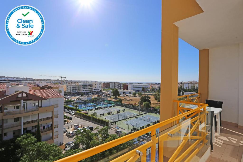 a balcony with a view of a city at Casas do SOL GuestHouse Lagos in Lagos