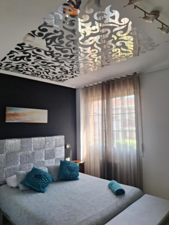 A bed or beds in a room at Intxaurti Etxea