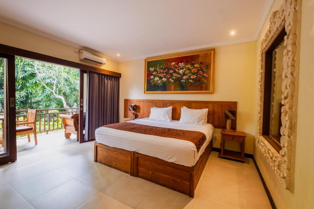 Postel nebo postele na pokoji v ubytování Alamdini Resort Ubud
