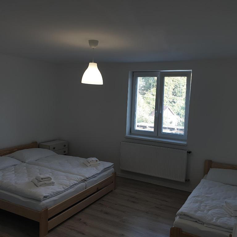 Postel nebo postele na pokoji v ubytování Apartmán Stará Myjava