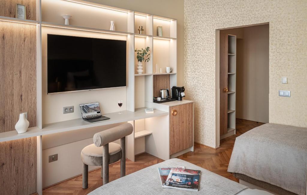 Postel nebo postele na pokoji v ubytování Hotel Maestro by Adrez