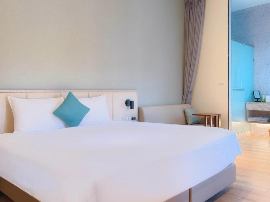 Postel nebo postele na pokoji v ubytování Hotel Sandao
