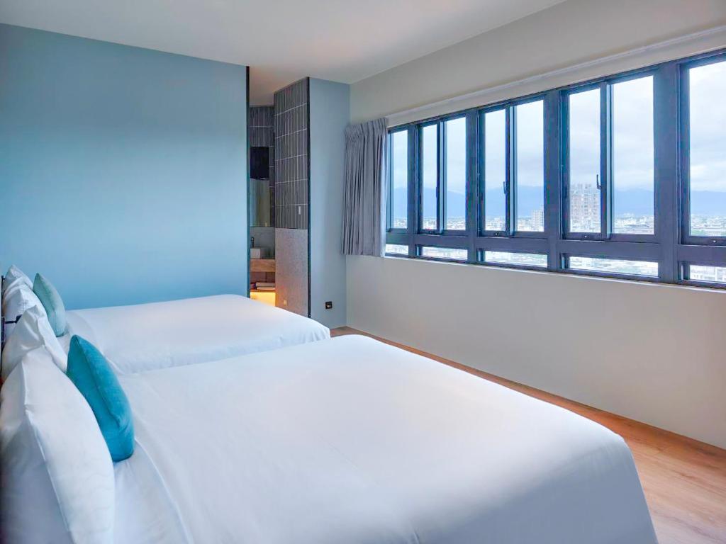 Postel nebo postele na pokoji v ubytování Hotel Sandao