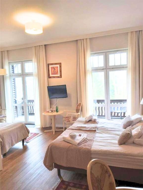 Postel nebo postele na pokoji v ubytování Villa Lessing