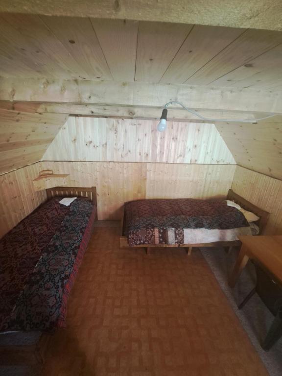 Postel nebo postele na pokoji v ubytování Koliba Kod Begija