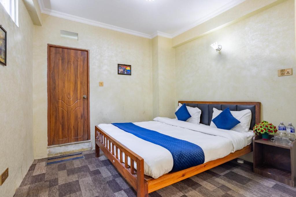 Postel nebo postele na pokoji v ubytování Chengfu Hotel And Restaurant