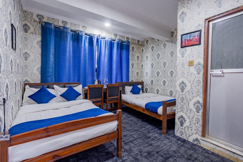 Postel nebo postele na pokoji v ubytování Chengfu Hotel And Restaurant