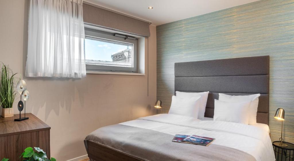 Postel nebo postele na pokoji v ubytování VN17 Rooftop Suites by Adrez