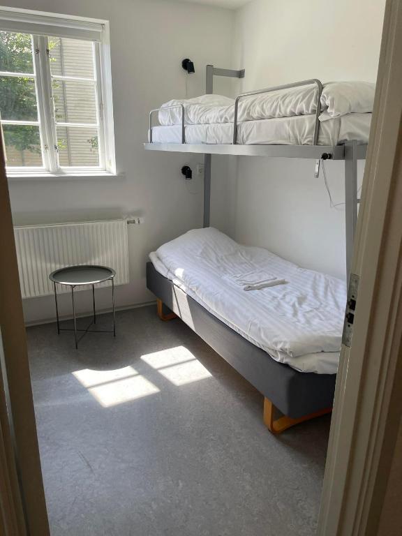 Postel nebo postele na pokoji v ubytování Faaborg Vandrerhjem