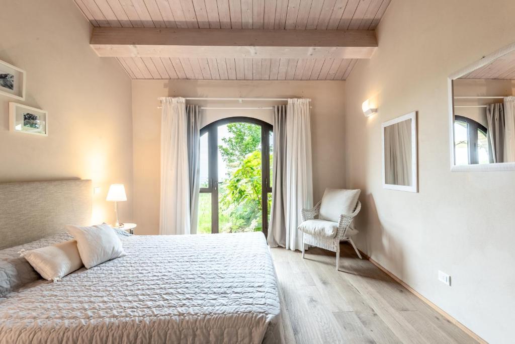 Postel nebo postele na pokoji v ubytování Cignella Resort