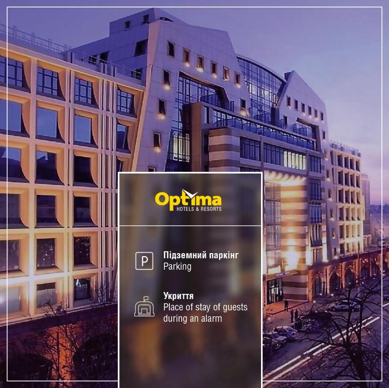 a sign in front of a large building at Optima Odesa in Odesa