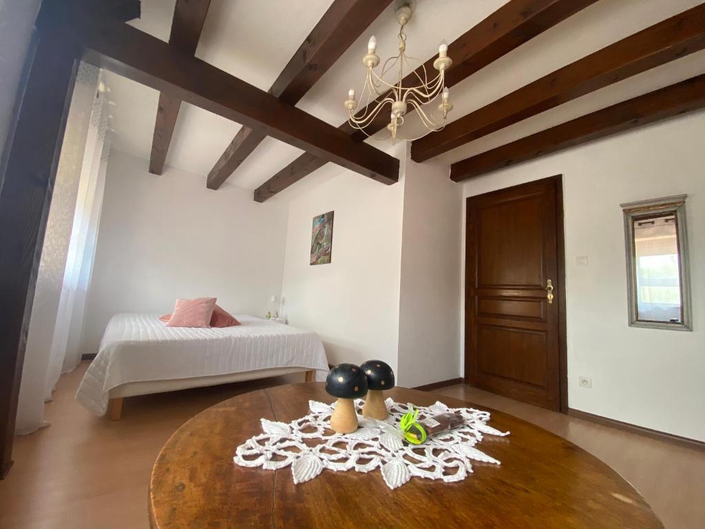 Postel nebo postele na pokoji v ubytování Relais du Dompeter