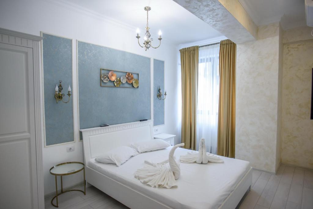 Ένα ή περισσότερα κρεβάτια σε δωμάτιο στο Solid Residence Mamaia