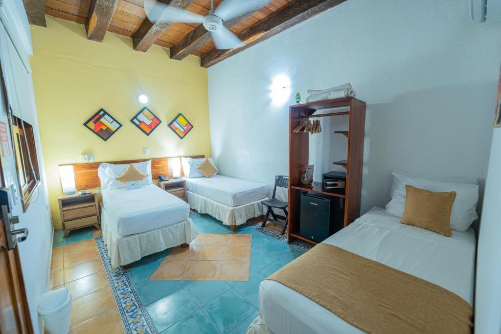 Postel nebo postele na pokoji v ubytování Hotel 3 Banderas
