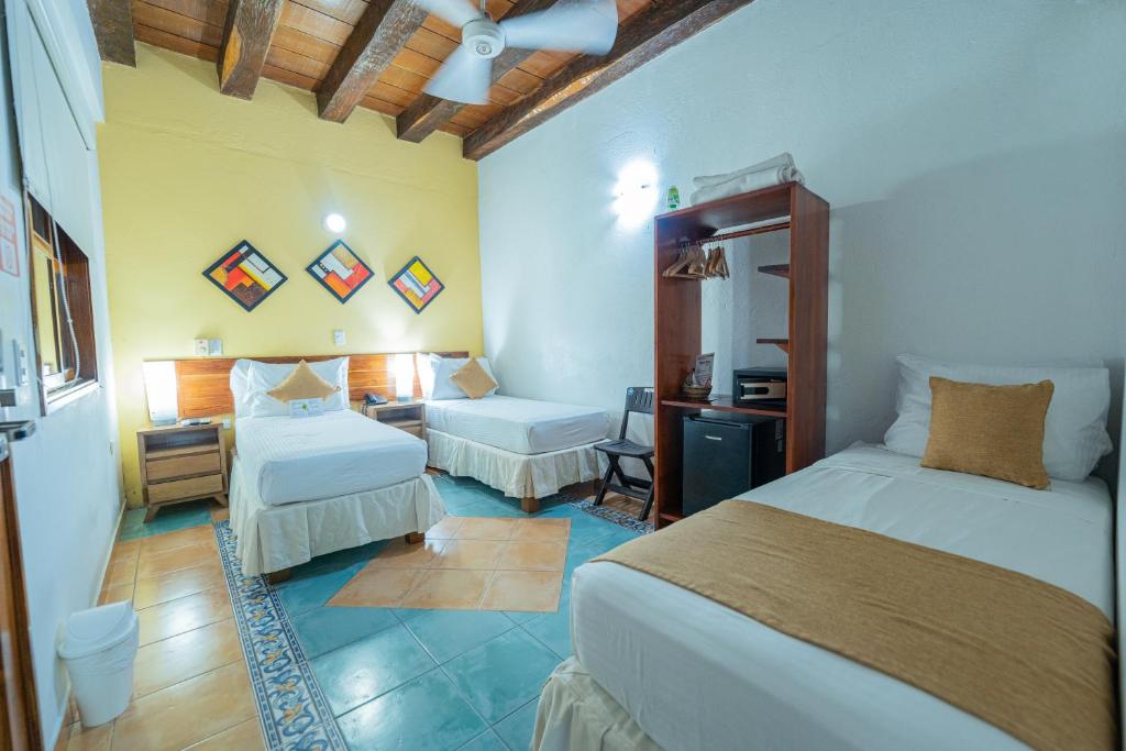 Postel nebo postele na pokoji v ubytování Hotel 3 Banderas