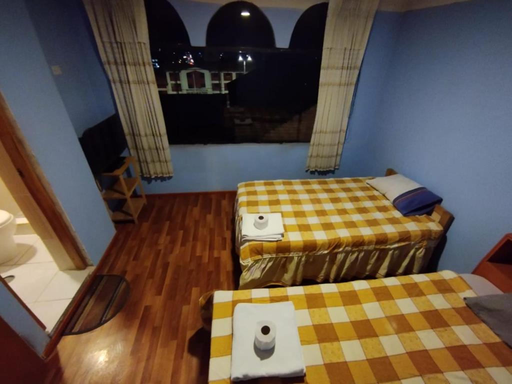 Postel nebo postele na pokoji v ubytování Inti Ut'ha