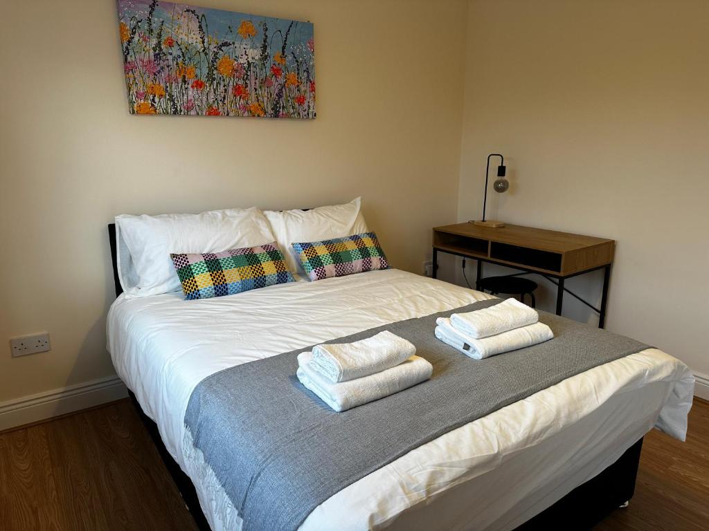 Postel nebo postele na pokoji v ubytování Warm Welcome Rooms