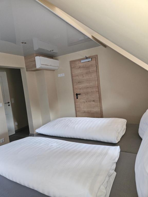 Postel nebo postele na pokoji v ubytování Klein Haus 12A