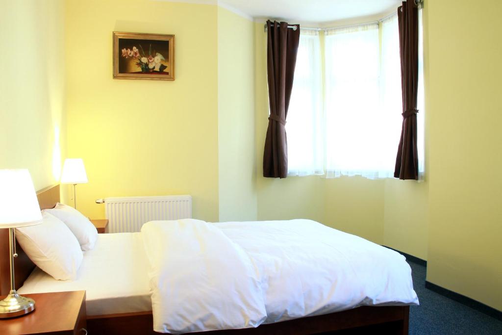 Postel nebo postele na pokoji v ubytování Hotel Vera