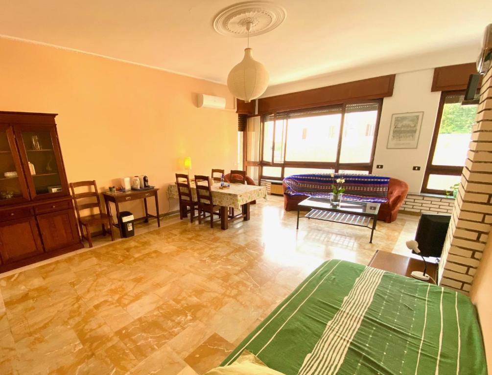 a living room with a couch and a table at Villa Cuten in Calco