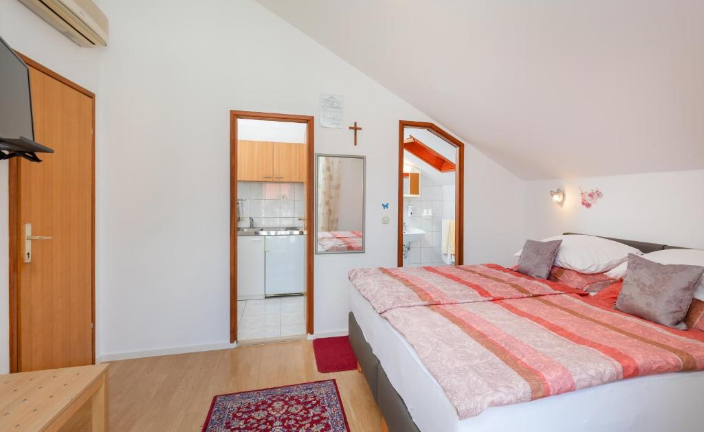 Кровать или кровати в номере Apartmani Galić 2