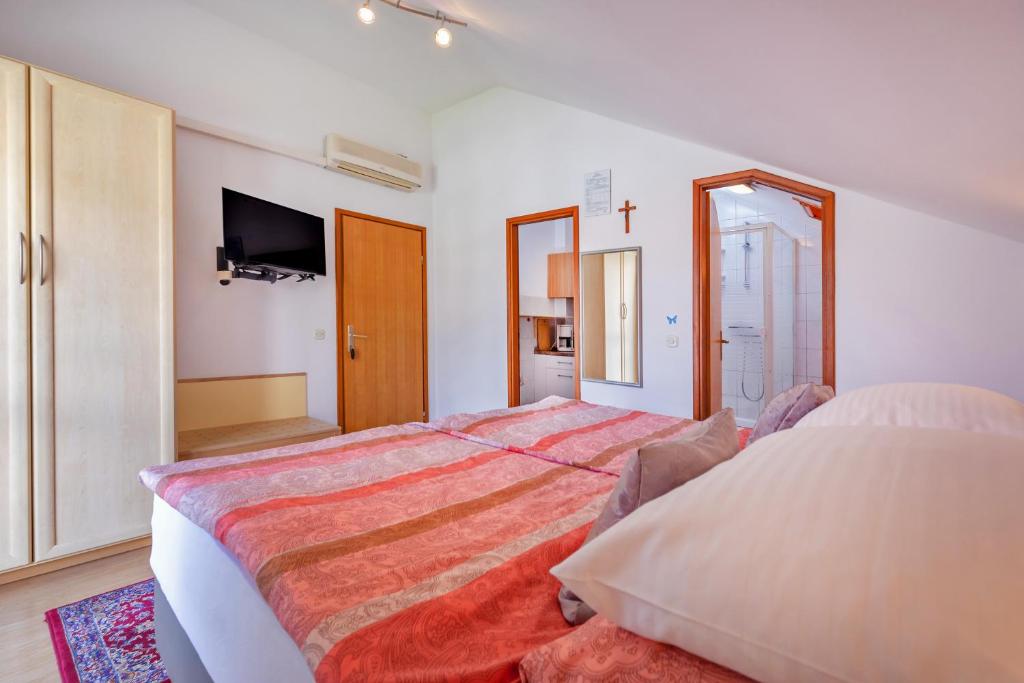 Кровать или кровати в номере Apartmani Galić 2