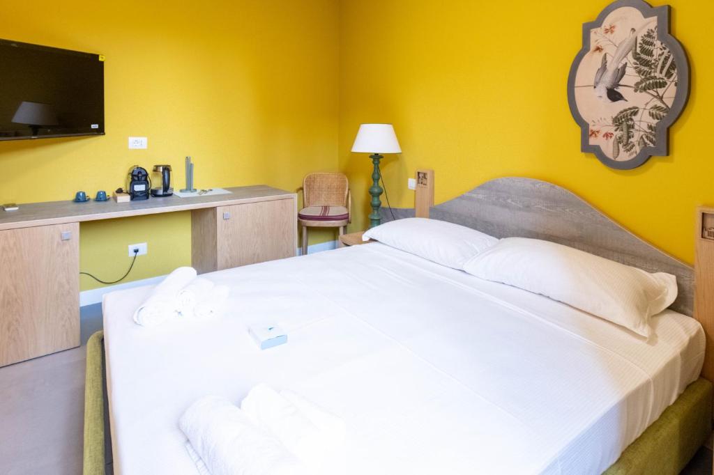 Postel nebo postele na pokoji v ubytování San Giuseppe Suite Lake Como