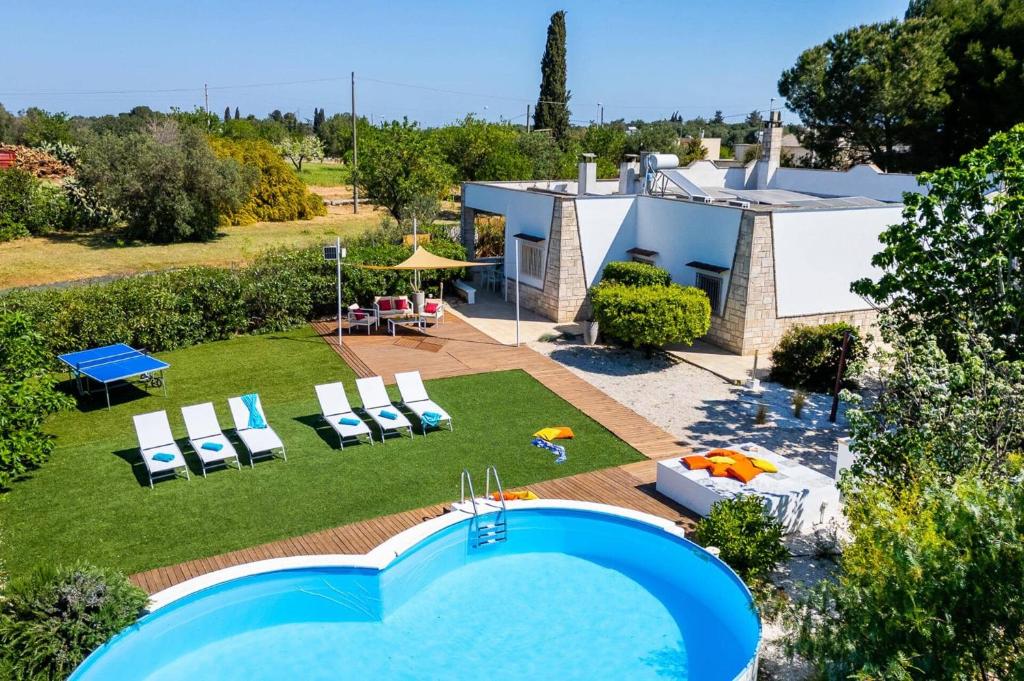 an aerial view of a house with a swimming pool at Villa Ambra by Villa Plus in San Vito dei Normanni