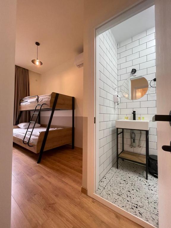 Postel nebo postele na pokoji v ubytování DRO Hotel