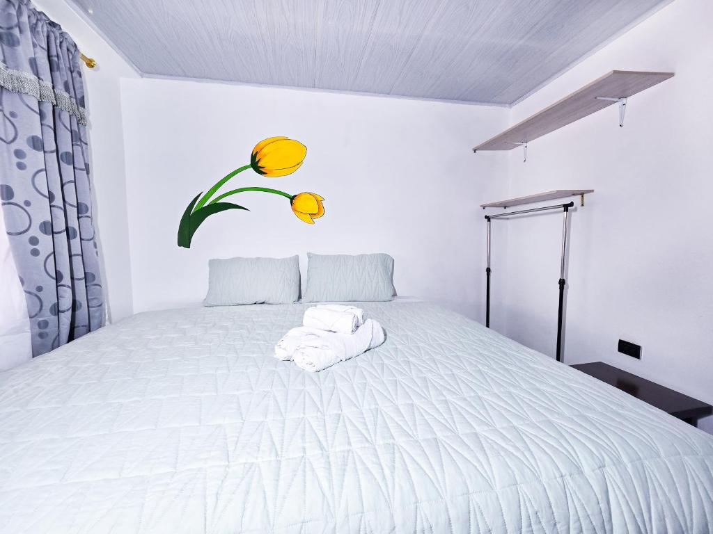 Postel nebo postele na pokoji v ubytování Casa Tulipán