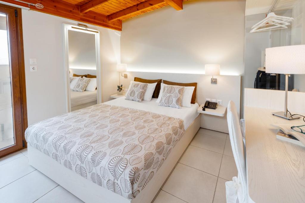Voodi või voodid majutusasutuse Athos Guest House Pansion toas