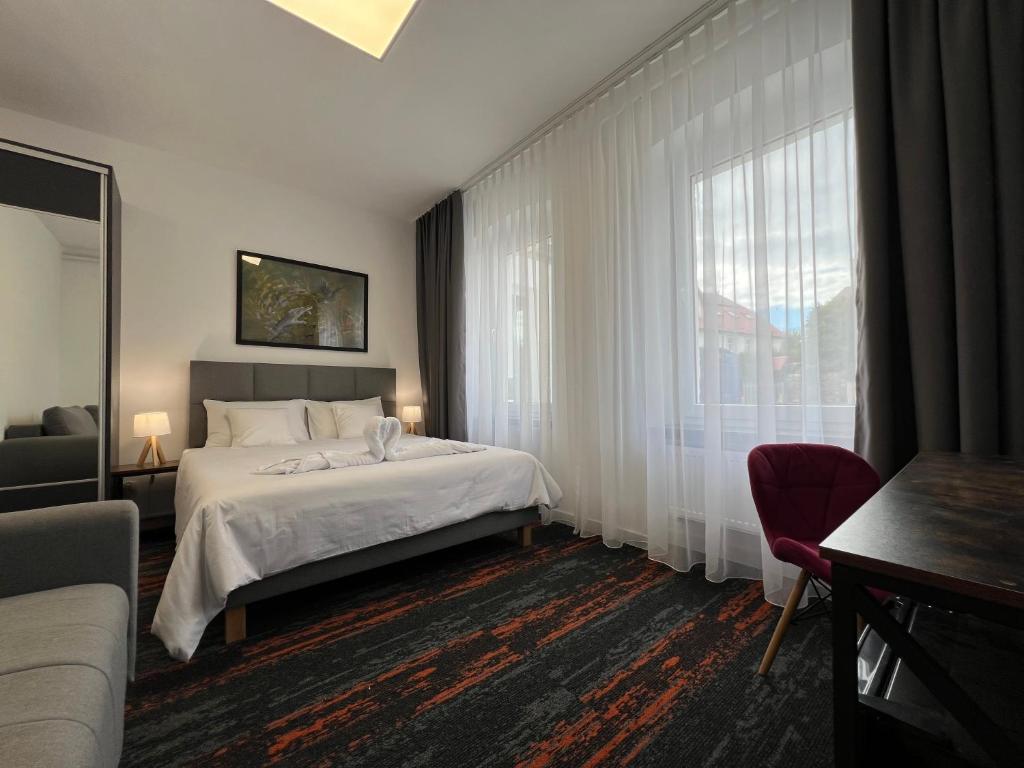 Postel nebo postele na pokoji v ubytování Apartamenty Makadamia