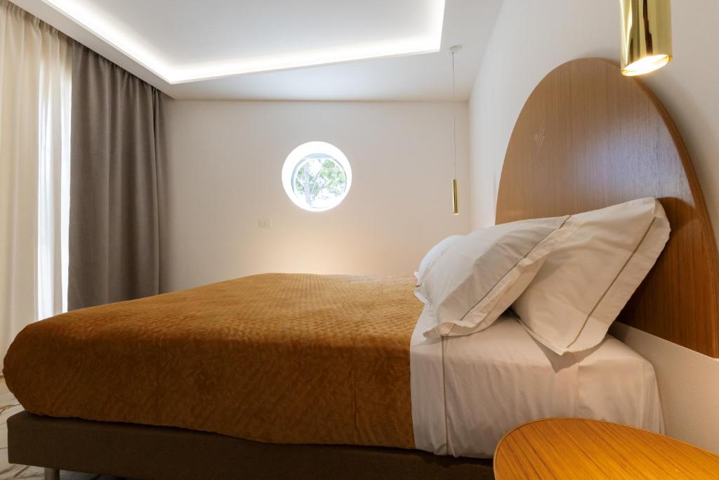 Postel nebo postele na pokoji v ubytování Maggiano Boutique Hotel
