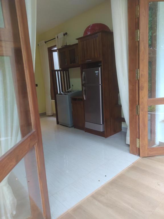 Kuchyň nebo kuchyňský kout v ubytování Kandy Lotus Chalet