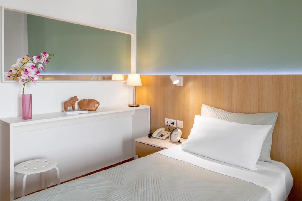 Voodi või voodid majutusasutuse Athos Guest House Pansion toas