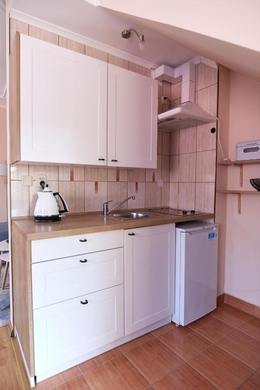 Kuchyň nebo kuchyňský kout v ubytování Ośrodek Wypoczynkowy Relaks i Apartamenty