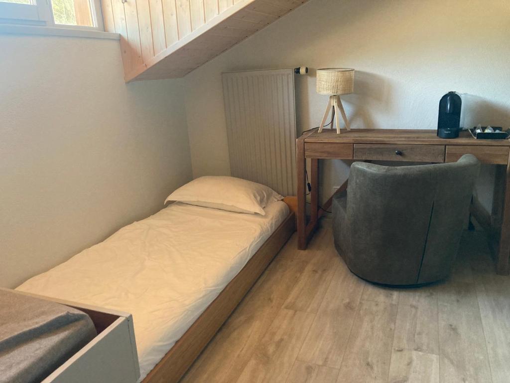 Postel nebo postele na pokoji v ubytování L'Arborescence