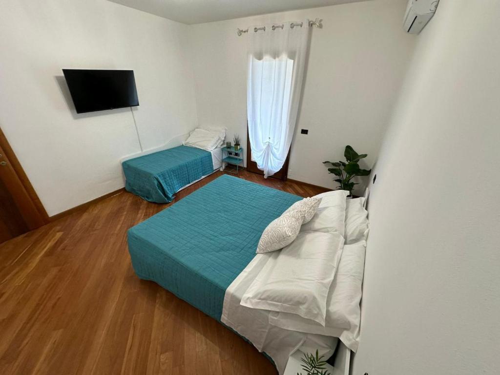 Postel nebo postele na pokoji v ubytování Villa Aurora in Erbusco-Franciacorta