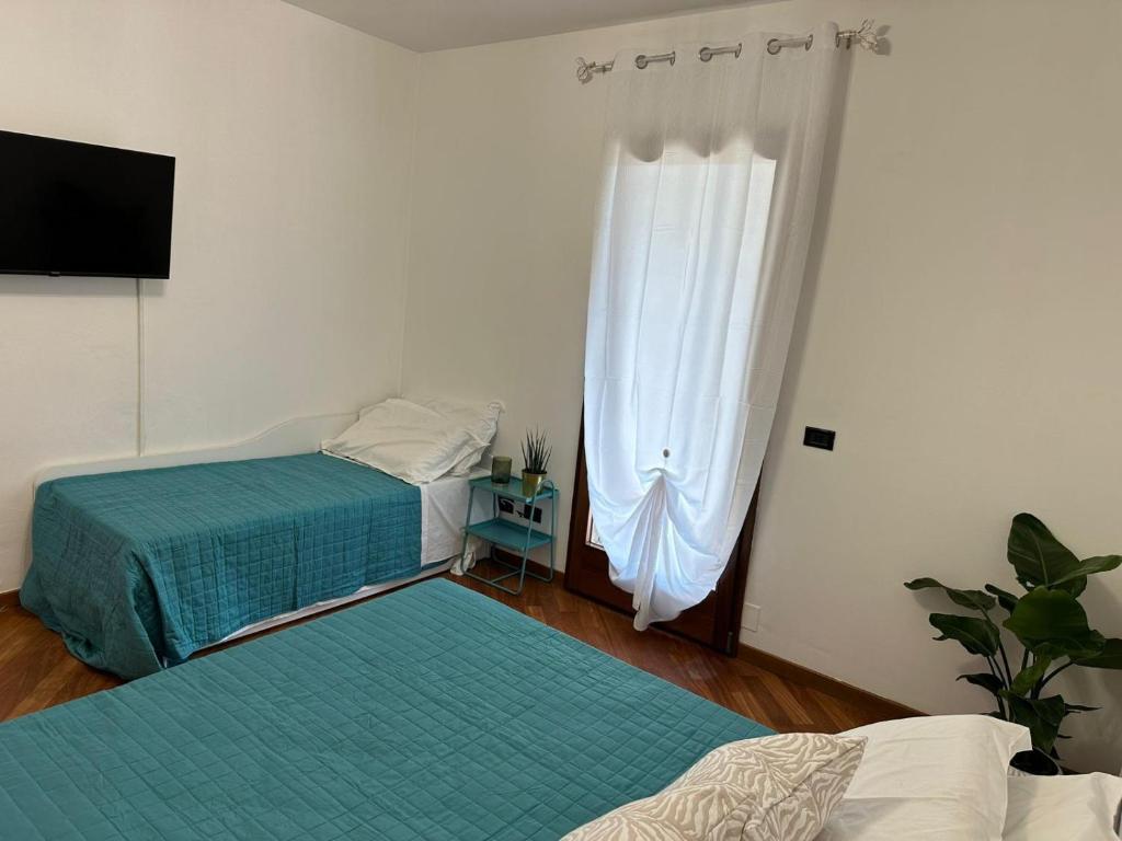 Postel nebo postele na pokoji v ubytování Villa Aurora in Erbusco-Franciacorta