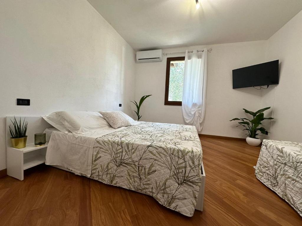 Postel nebo postele na pokoji v ubytování Villa Aurora in Erbusco-Franciacorta