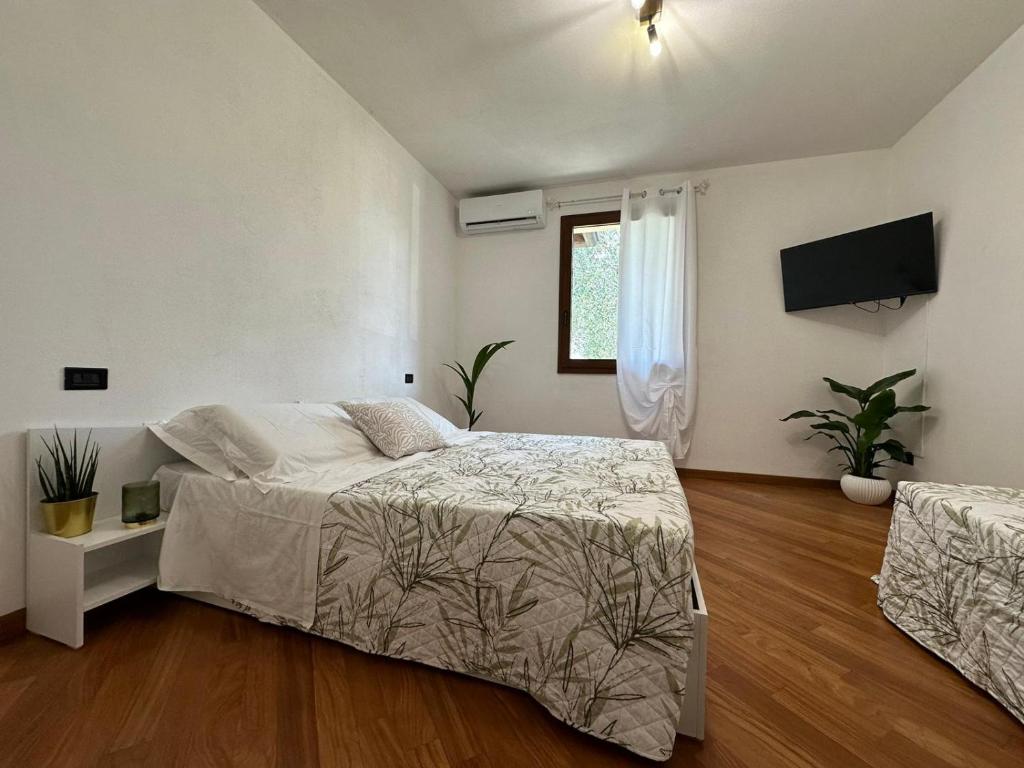 Postel nebo postele na pokoji v ubytování Villa Aurora in Erbusco-Franciacorta